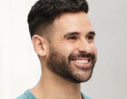 man smiling in profile